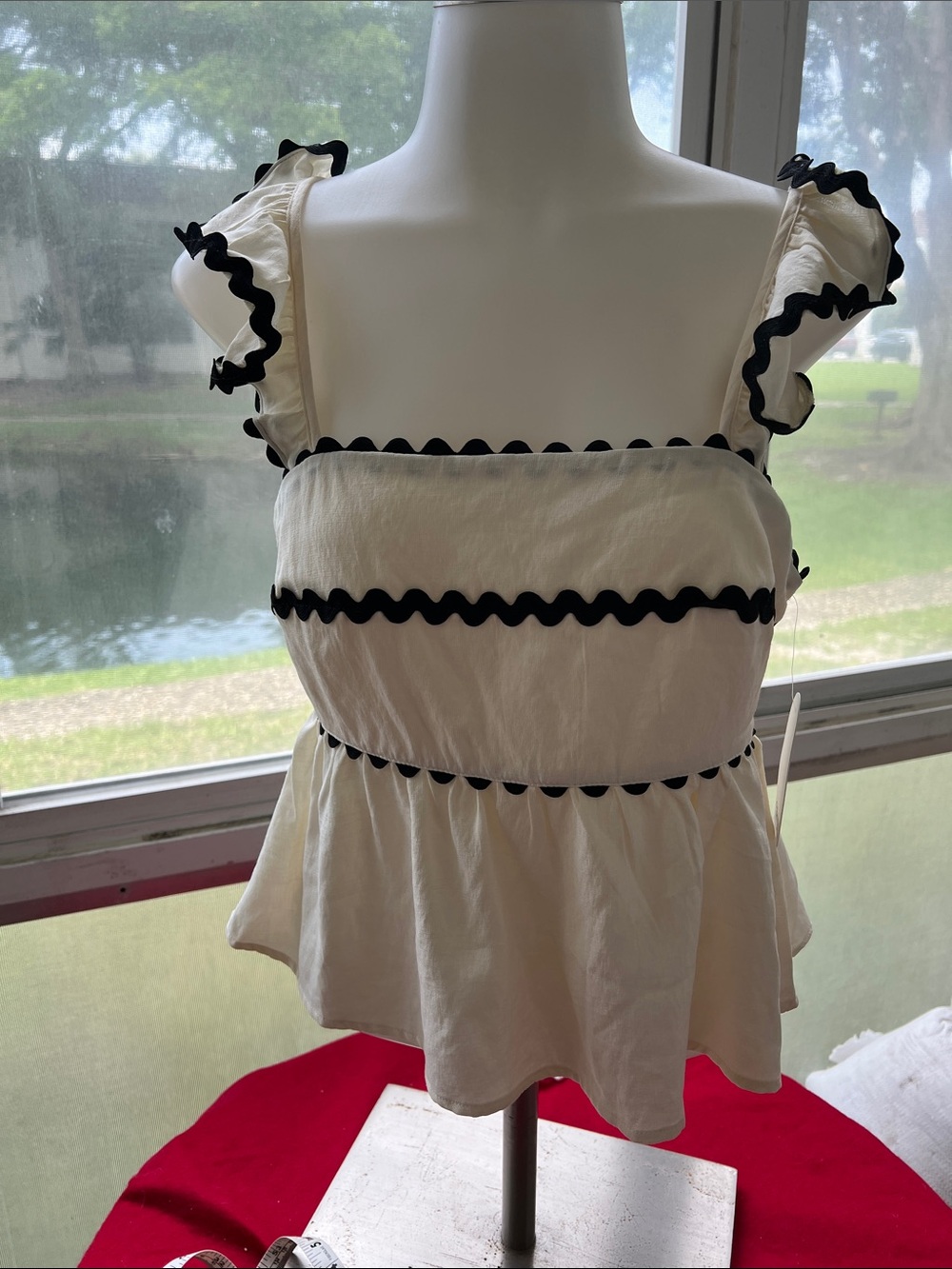 Trixxi Cream Ruffled Peplum Camisole with Black Trim